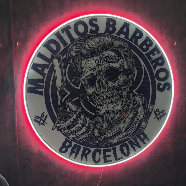 Rótulo circular de neón LED con el logo de la barbería Malditos Barberos