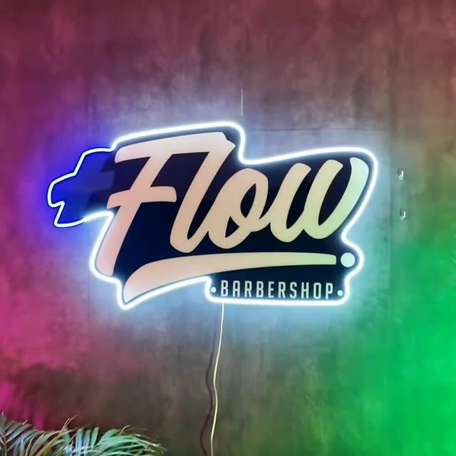 Rótulo de neón LED con el logo de Flow Barbershop