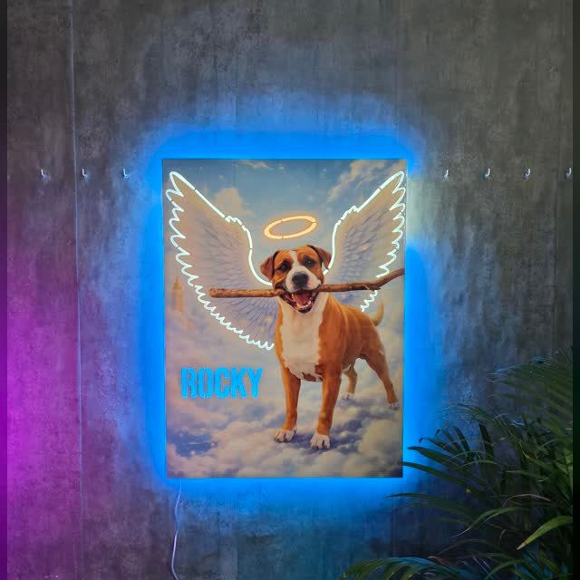 Cuadro multitroquelado de una mascota con alas en resina epoxi y neón LED